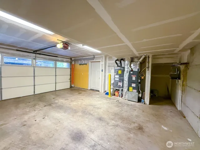 a view of a garage with walk in closet