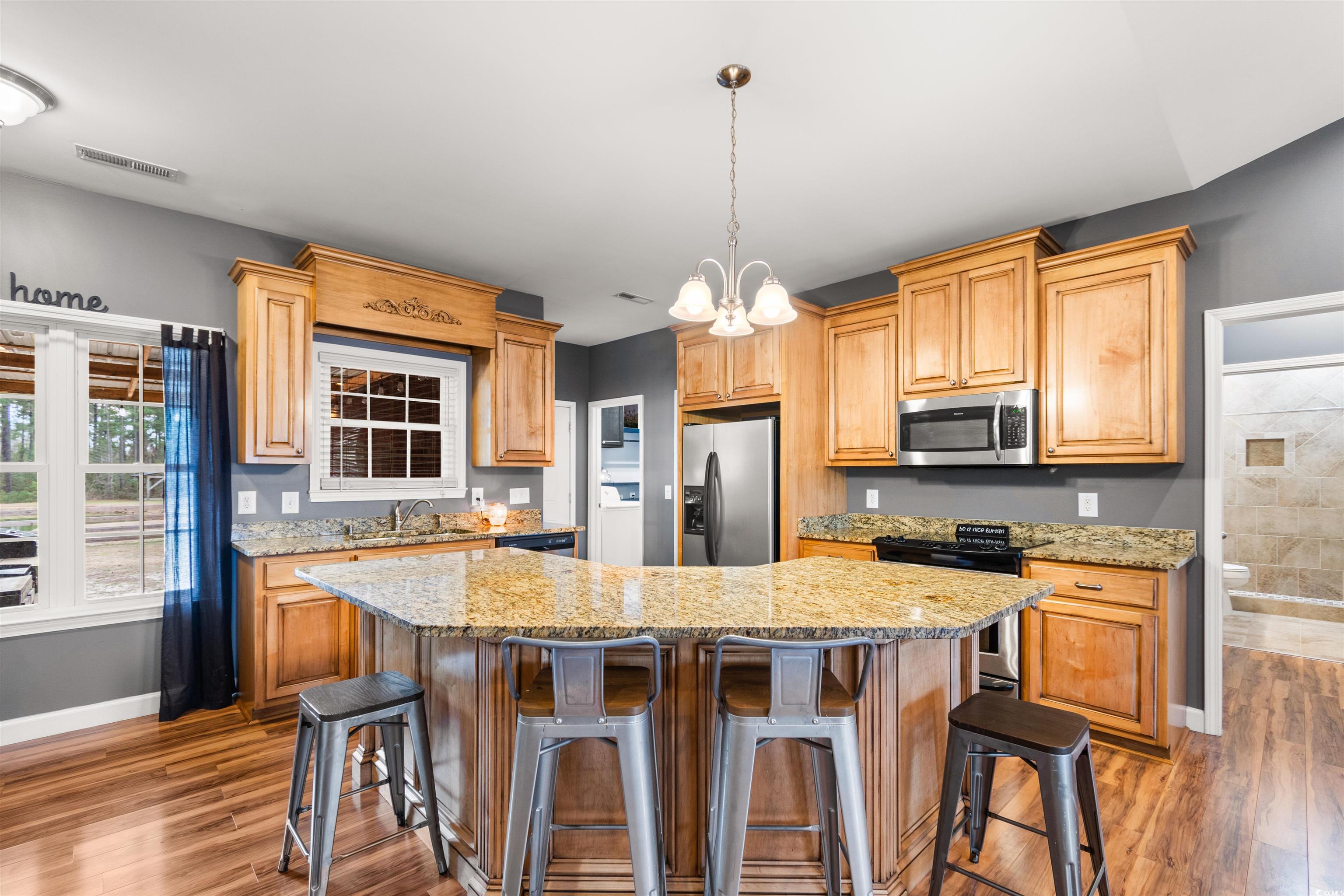 1291 Pisgah Church Road Aynor, SC 29511 - Photo 12 of 39 Kitchen featuring pendant lighting, a center islan