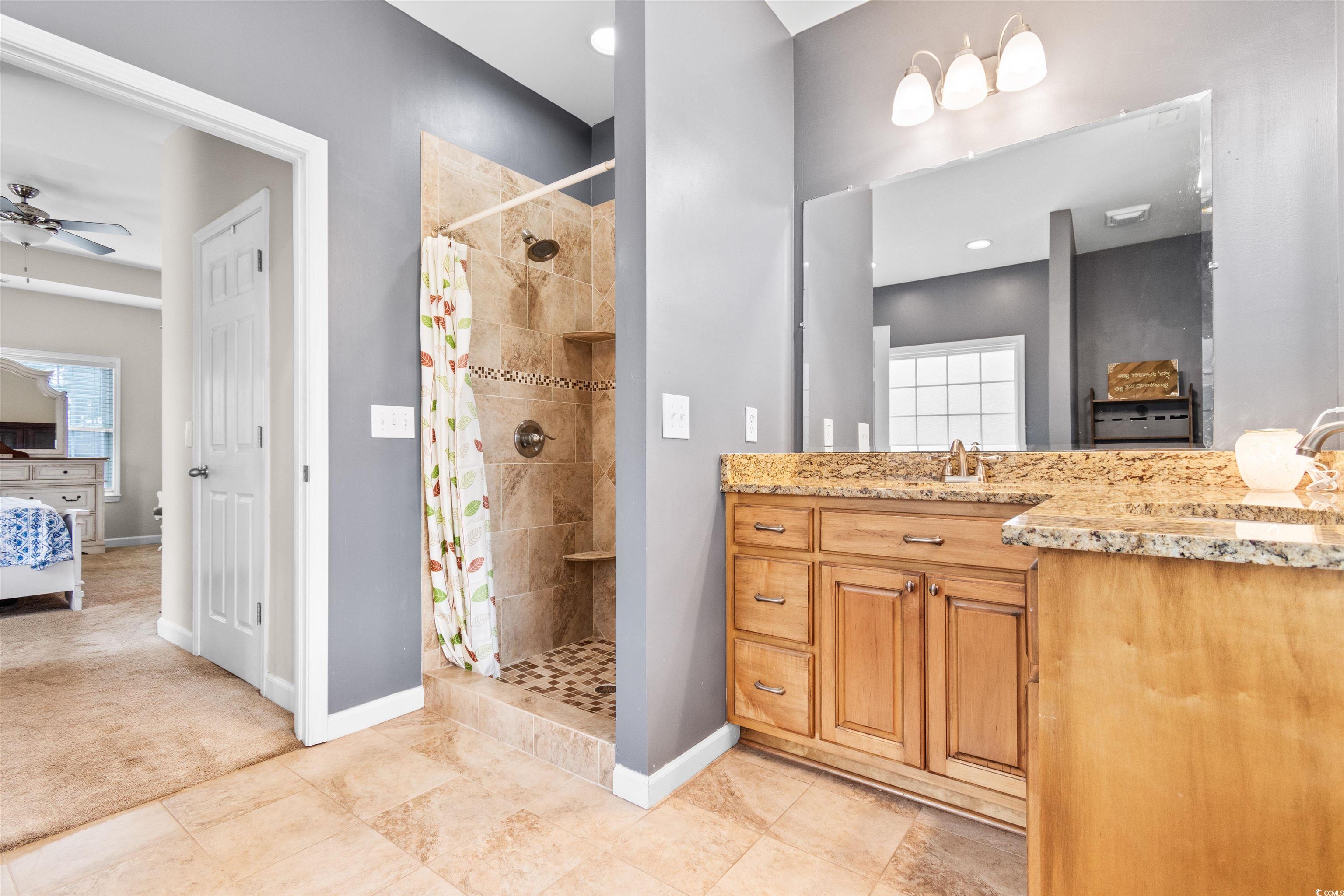 1291 Pisgah Church Road Aynor, SC 29511 - Photo 14 of 39 Bathroom with ceiling fan, walk in shower, and van