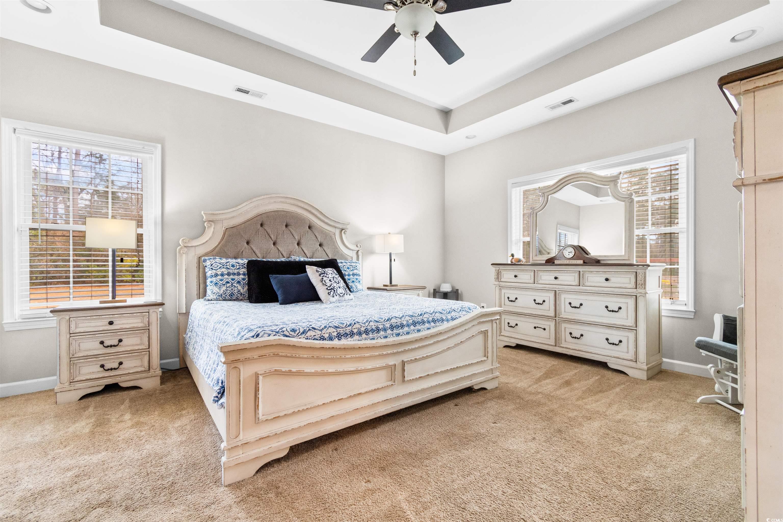 1291 Pisgah Church Road Aynor, SC 29511 - Photo 19 of 39 Carpeted bedroom with ceiling fan and a tray ceili