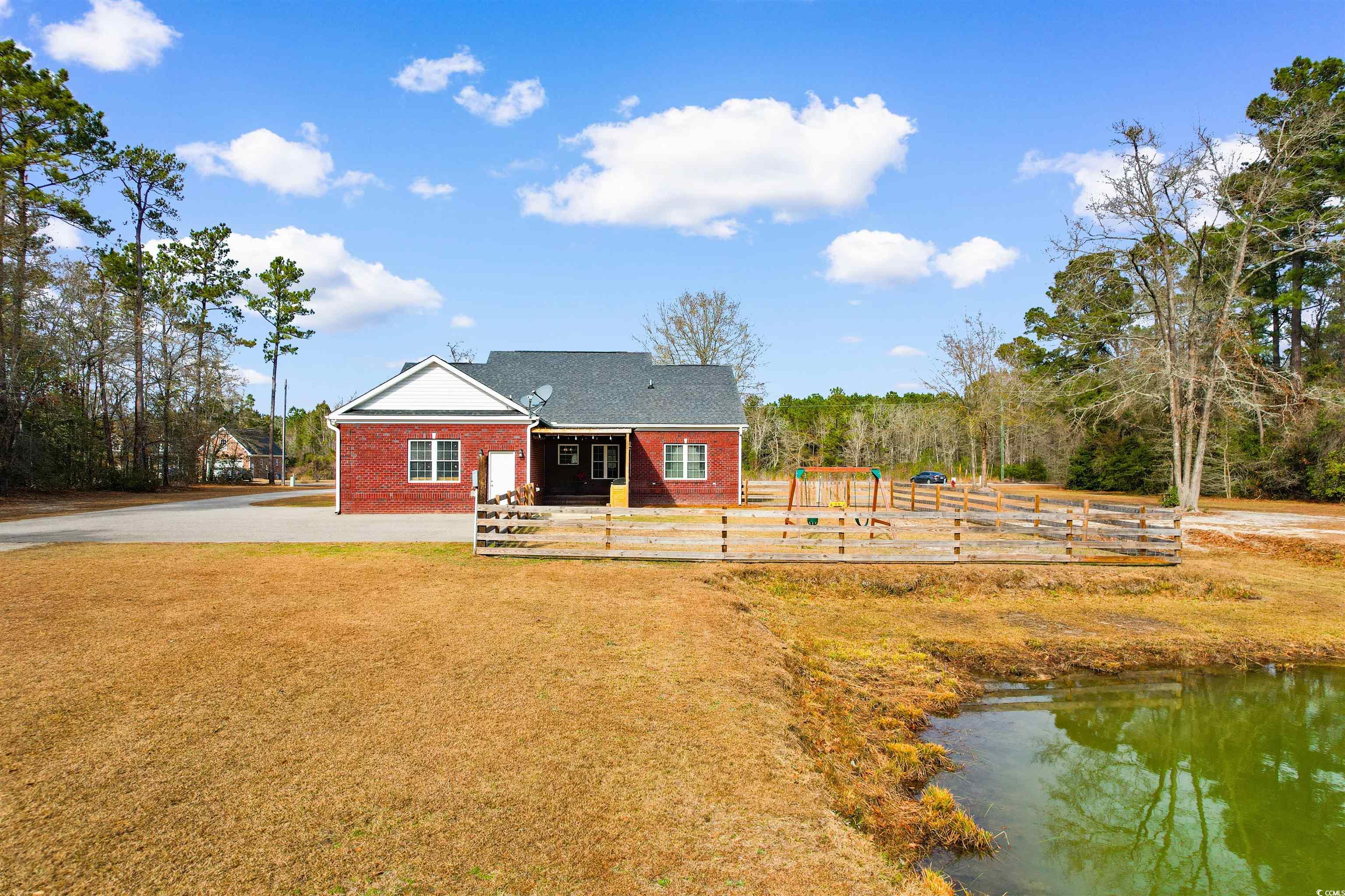 1291 Pisgah Church Road Aynor, SC 29511 - Photo 29 of 39 Rear view of house with a water view