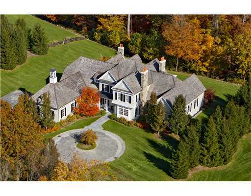 a aerial view of a house with a big yard
