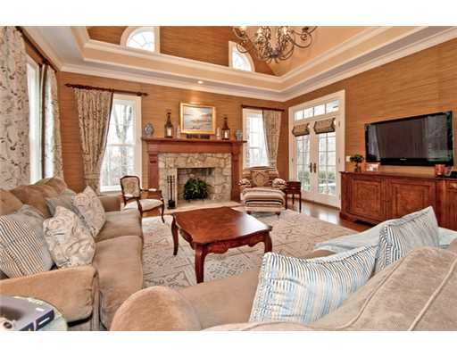 362 Brookside Road Darien, CT 06820 - Photo 12 of 20 a living room with furniture a fireplace and a flat screen tv