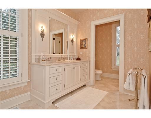 362 Brookside Road Darien, CT 06820 - Photo 17 of 20 a bathroom with a double vanity sink a mirror and a shower