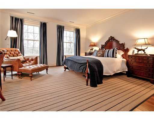 362 Brookside Road Darien, CT 06820 - Photo 18 of 20 a bedroom with a bed and wooden floor