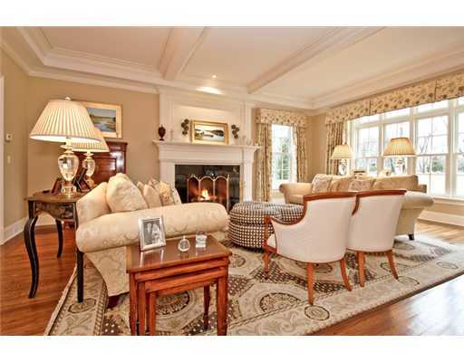 362 Brookside Road Darien, CT 06820 - Photo 5 of 20 a living room with furniture a fireplace and a table