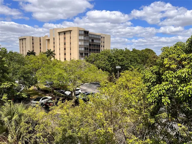 a picture of houses with city view