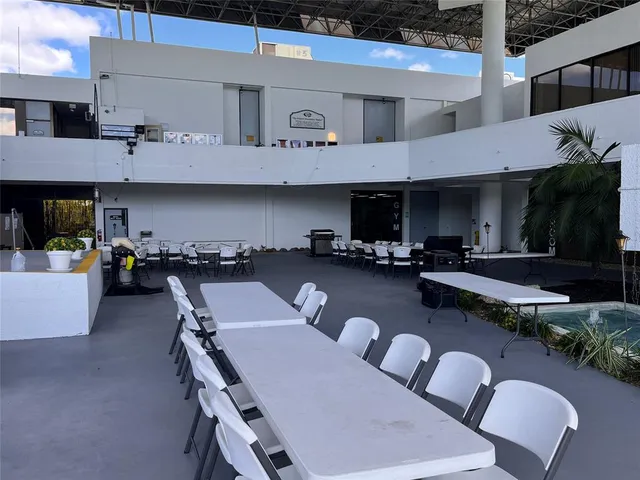 a view of a dinning table and chairs in the patio