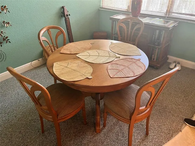 a view of a dining room with furniture