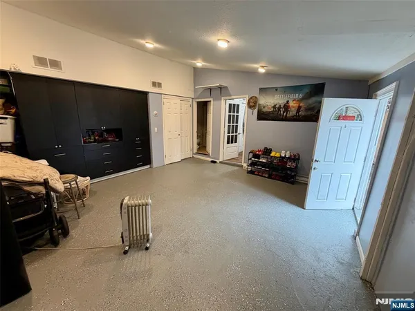 a view of a livingroom with furniture and a flat screen tv