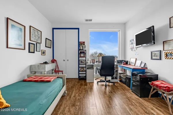 a workspace with furniture and wooden floor