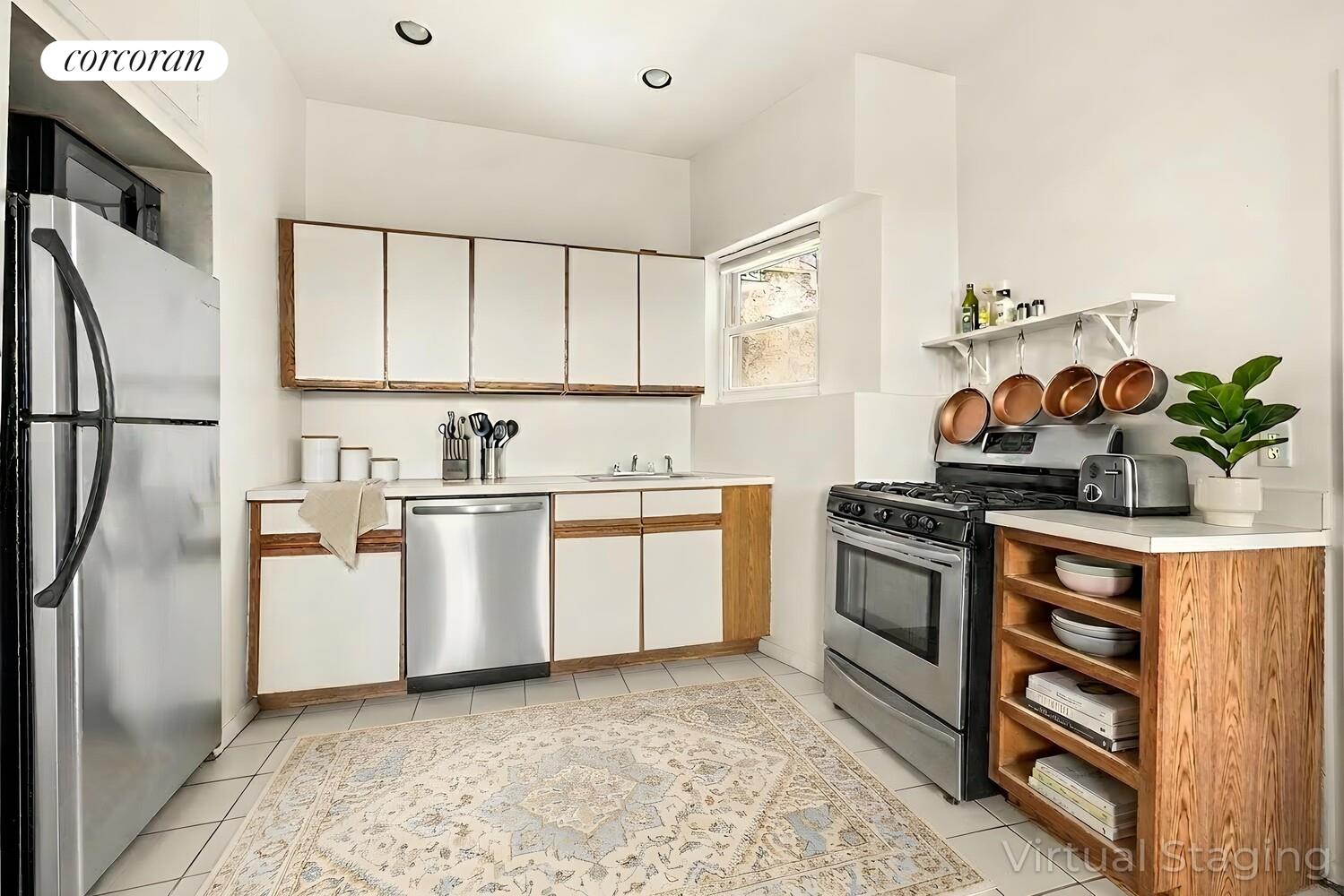 415 9th Street, Unit 51 Brooklyn, NY 11215 - Photo 2 of 6 a kitchen with white cabinets and white appliances
