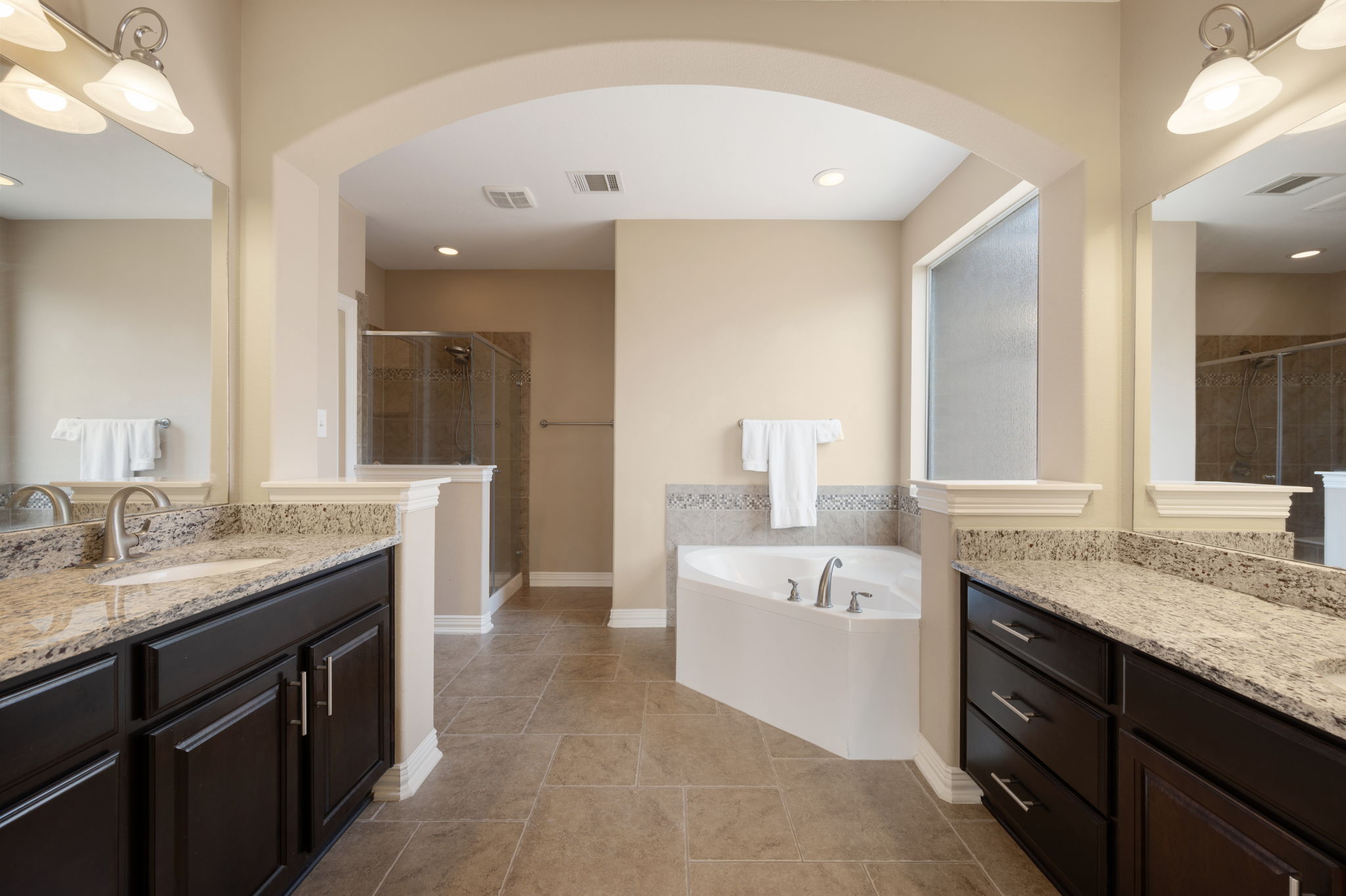 3904 Brean Down Road Pflugerville, TX 78660 - Photo 14 of 40 Full bath with two vanities, a stall shower, and a bath