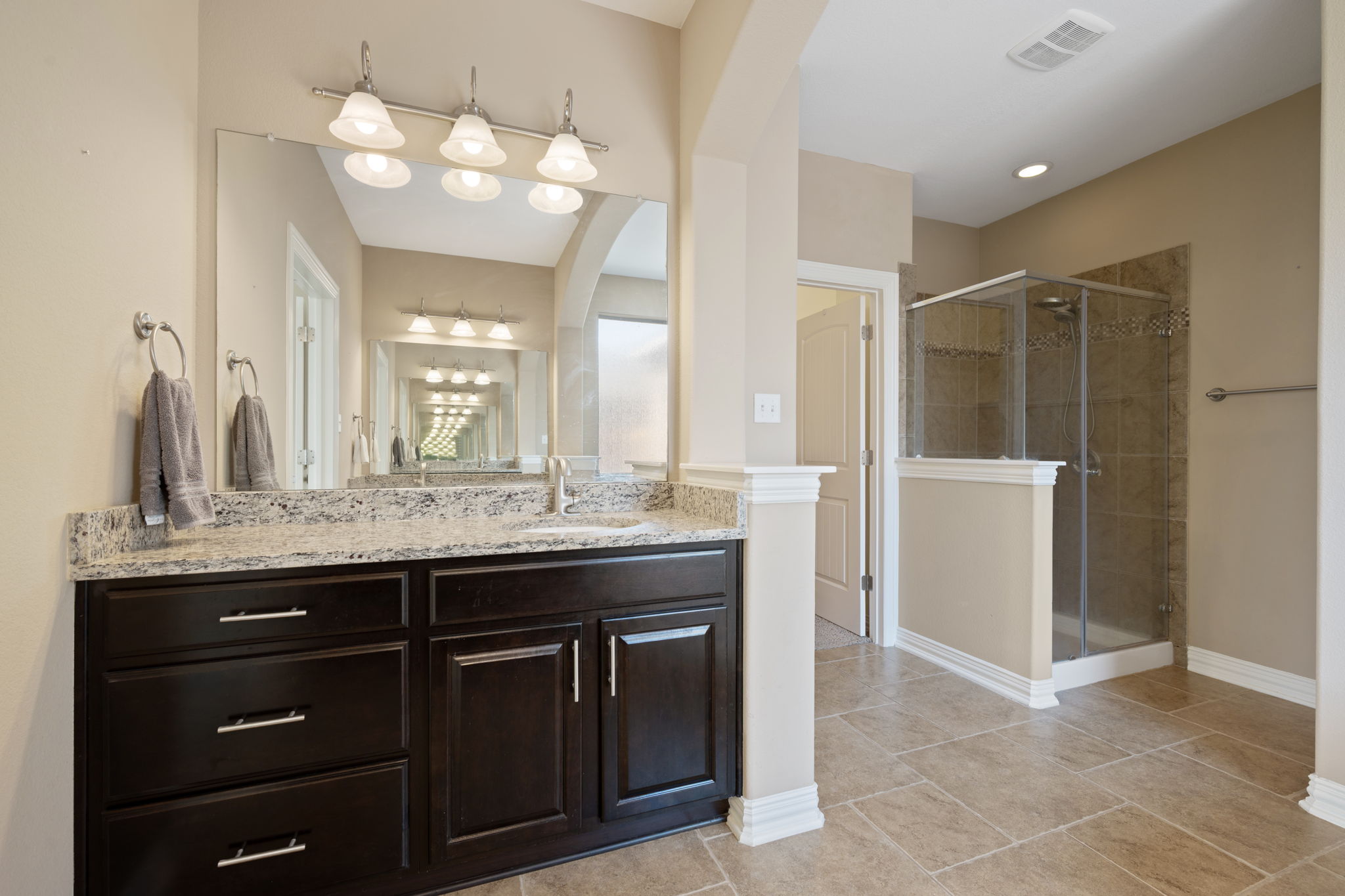 3904 Brean Down Road Pflugerville, TX 78660 - Photo 16 of 40 Full bath with vanity, a shower stall, and light tile patterned flooring