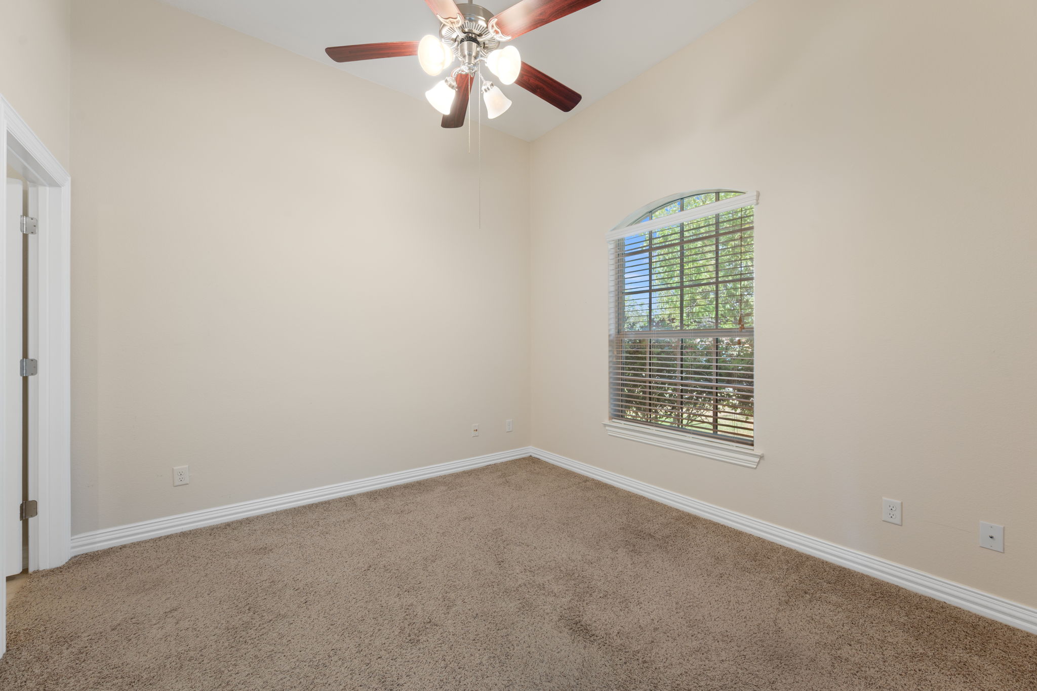 3904 Brean Down Road Pflugerville, TX 78660 - Photo 18 of 40 Empty room featuring carpet, ceiling fan, and vaulted ceiling