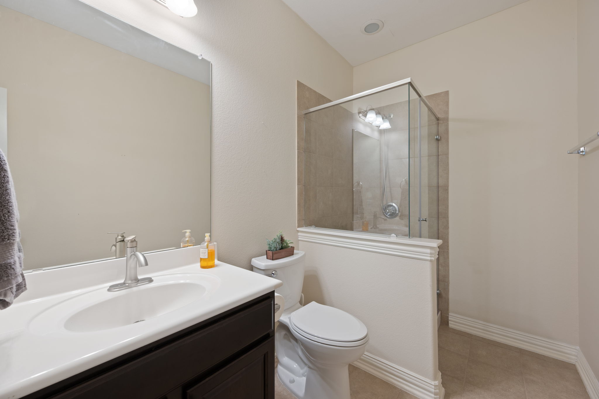 3904 Brean Down Road Pflugerville, TX 78660 - Photo 20 of 40 Bathroom with vanity, a shower stall, and light tile patterned floors