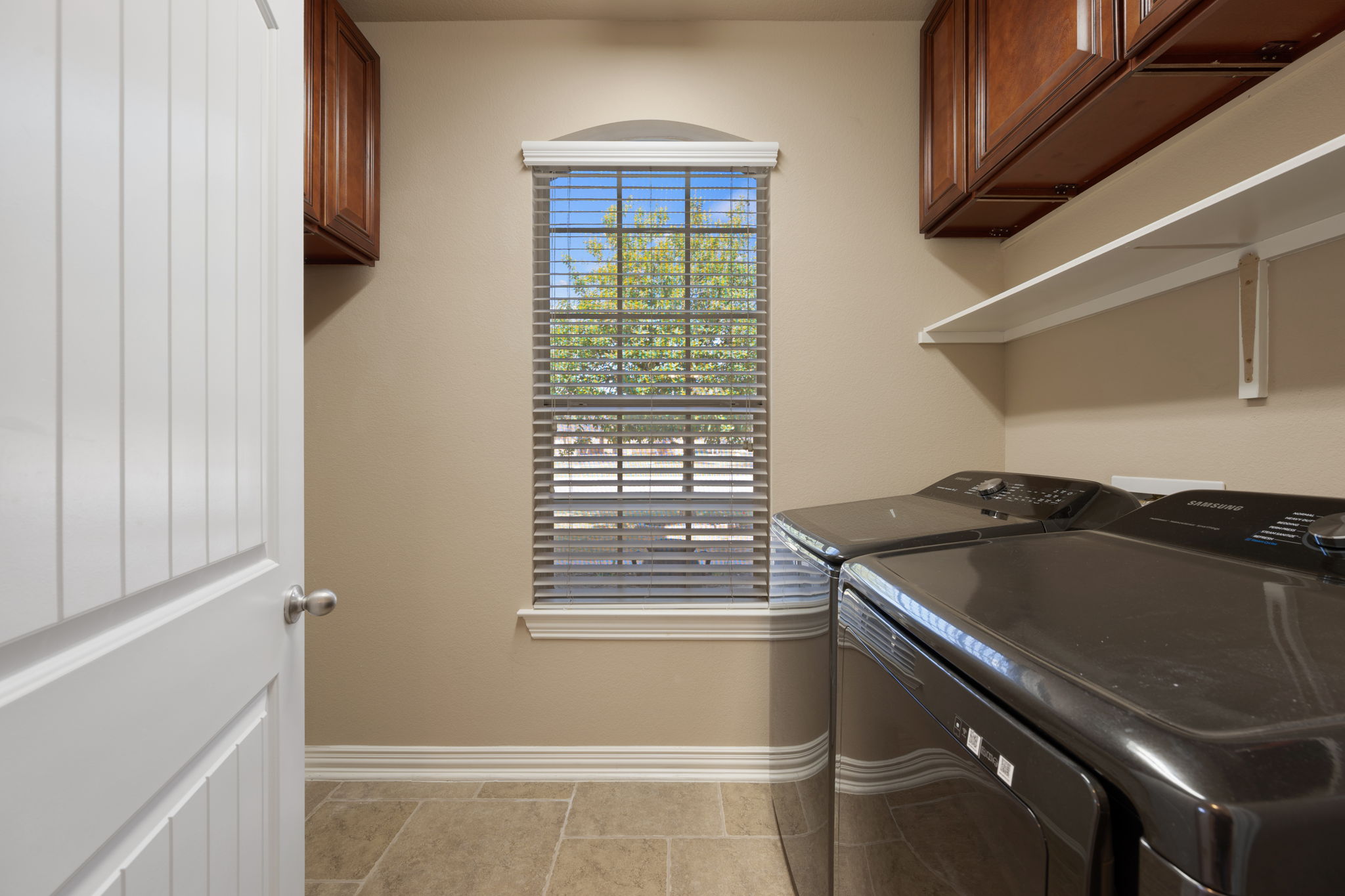 3904 Brean Down Road Pflugerville, TX 78660 - Photo 21 of 40 Laundry area with washer and dryer and cabinet space