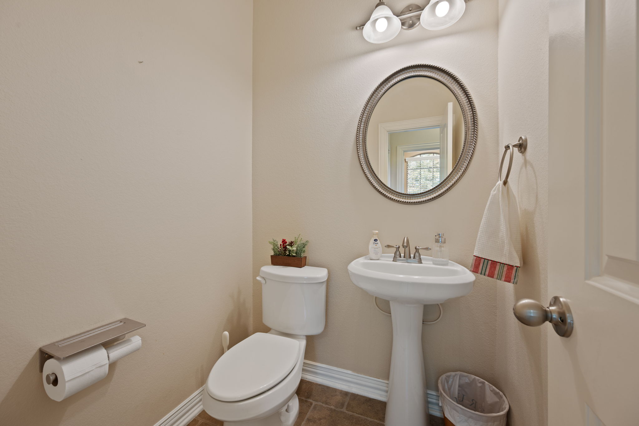 3904 Brean Down Road Pflugerville, TX 78660 - Photo 22 of 40 Half bath featuring toilet and dark tile patterned floors