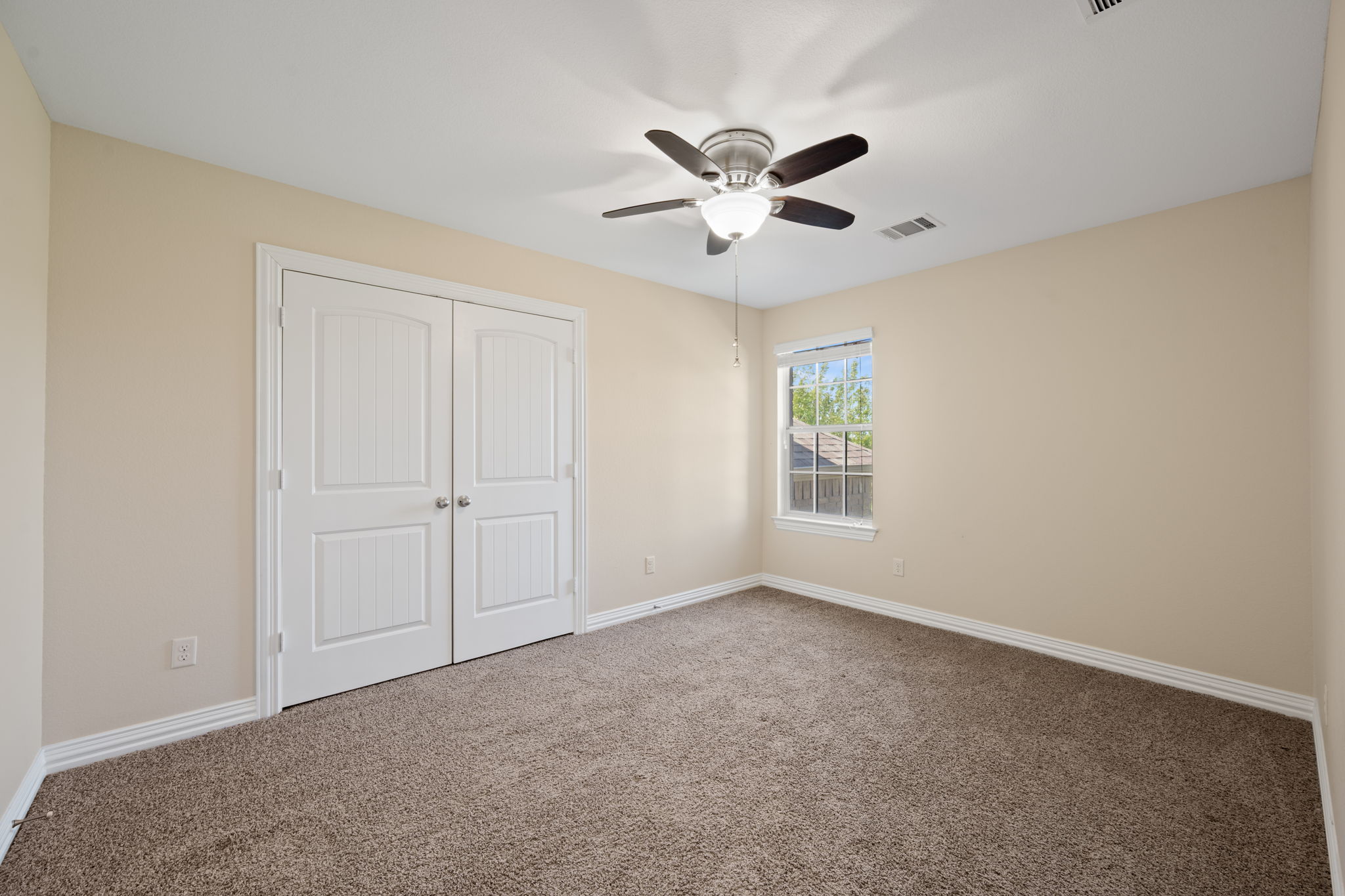 3904 Brean Down Road Pflugerville, TX 78660 - Photo 27 of 40 Unfurnished bedroom with carpet flooring, a closet, and a ceiling fan