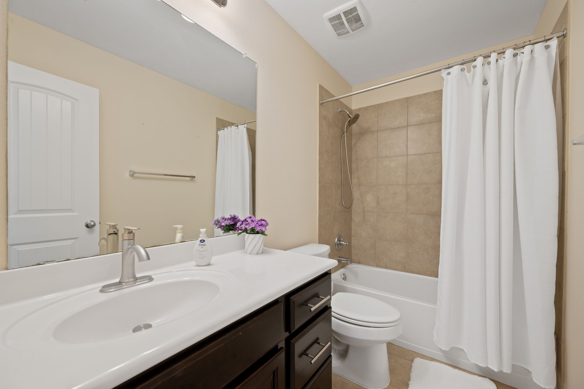 3904 Brean Down Road Pflugerville, TX 78660 - Photo 28 of 40 Full bath with vanity, shower / tub combo, and light tile patterned floors