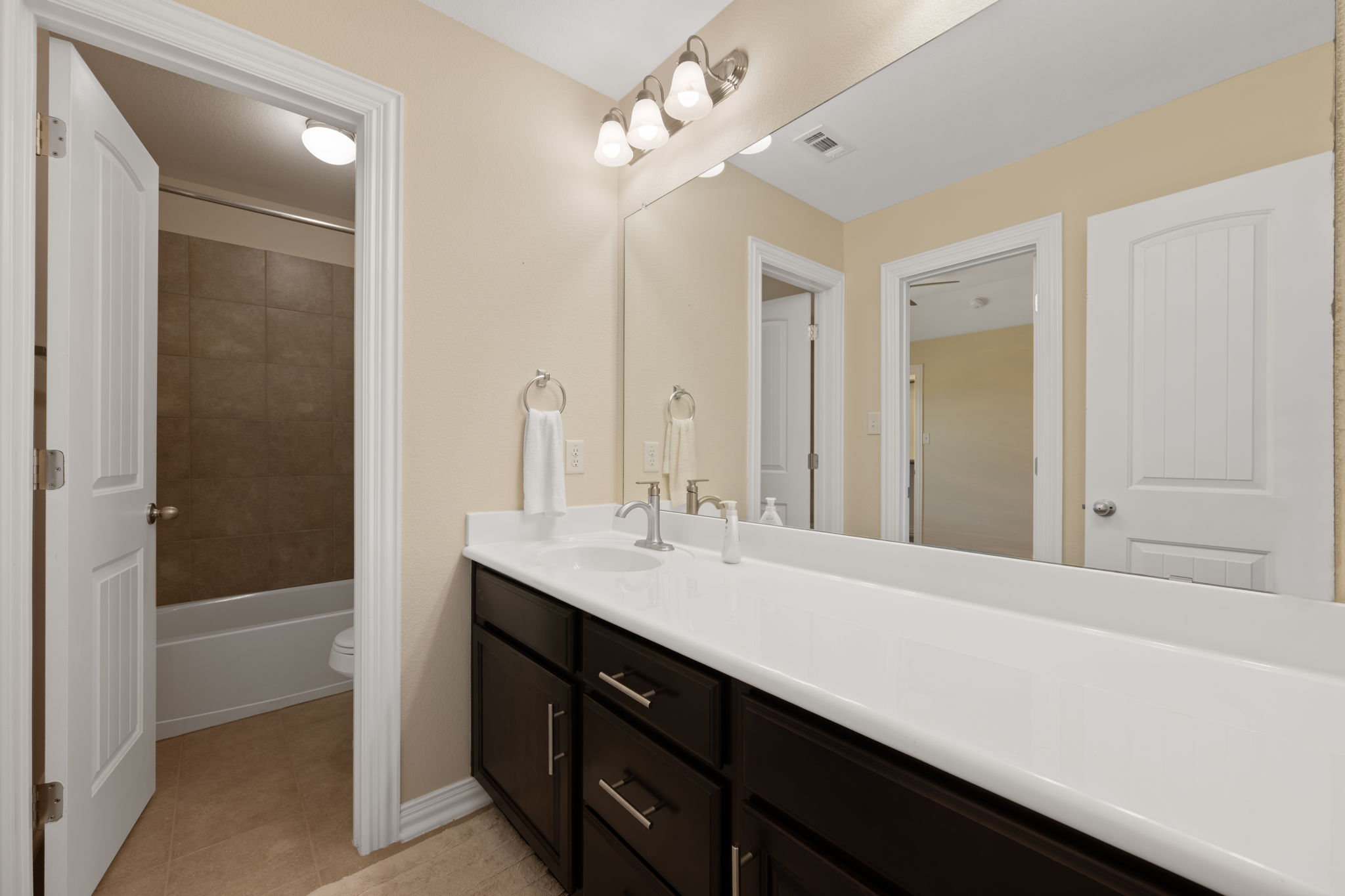 3904 Brean Down Road Pflugerville, TX 78660 - Photo 30 of 40 Full bathroom with vanity, light tile patterned floors, and shower / bath combination