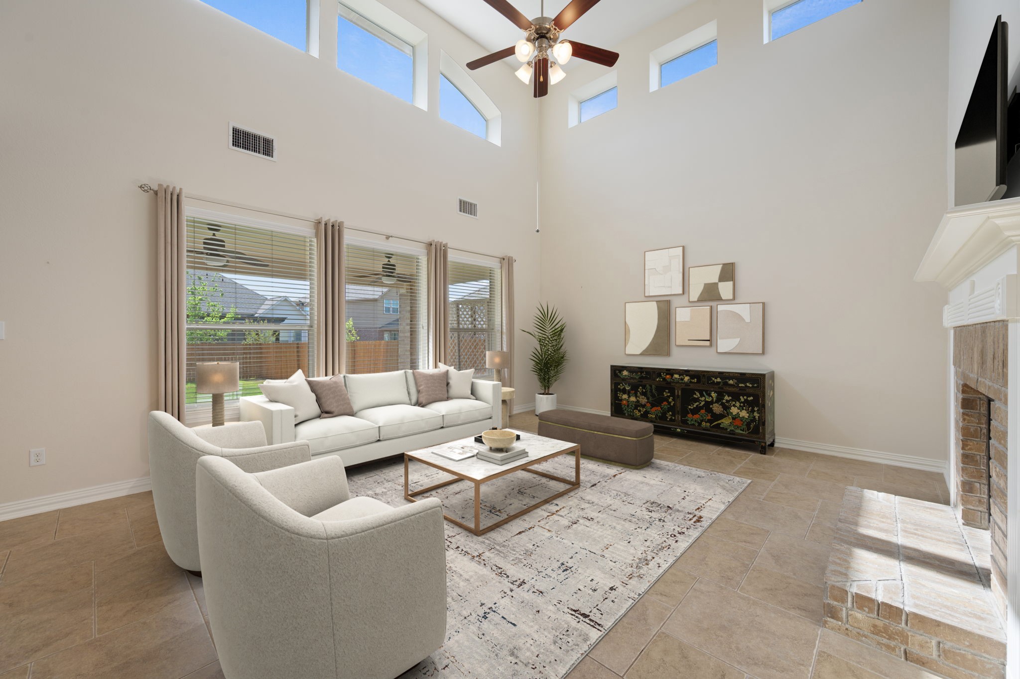 3904 Brean Down Road Pflugerville, TX 78660 - Photo 5 of 40 Living room with a brick fireplace, a ceiling fan, and a high ceiling