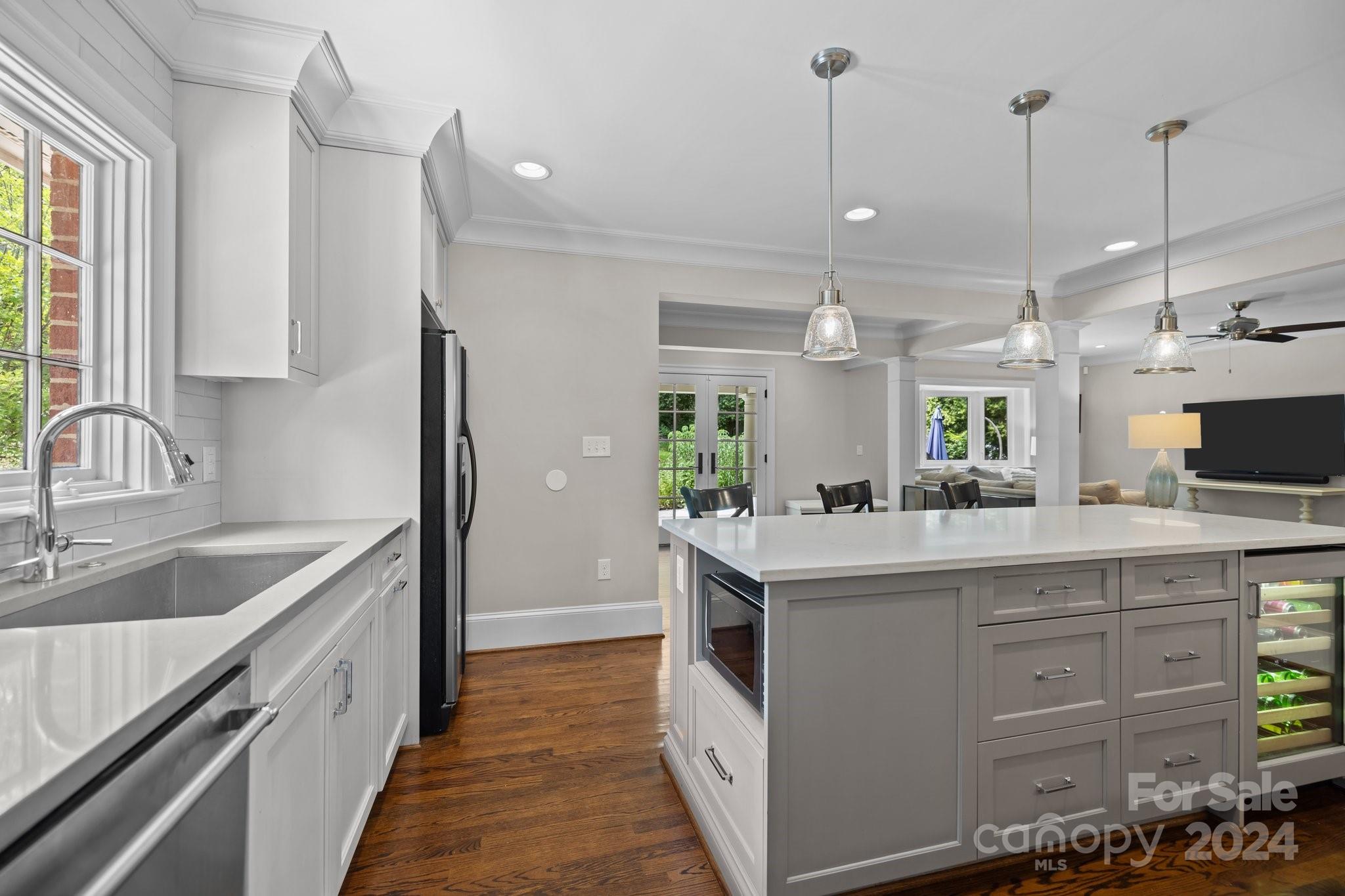 2414 Inverness Road Charlotte, NC 28209 - Photo 15 of 46 a kitchen with a sink stove and cabinets