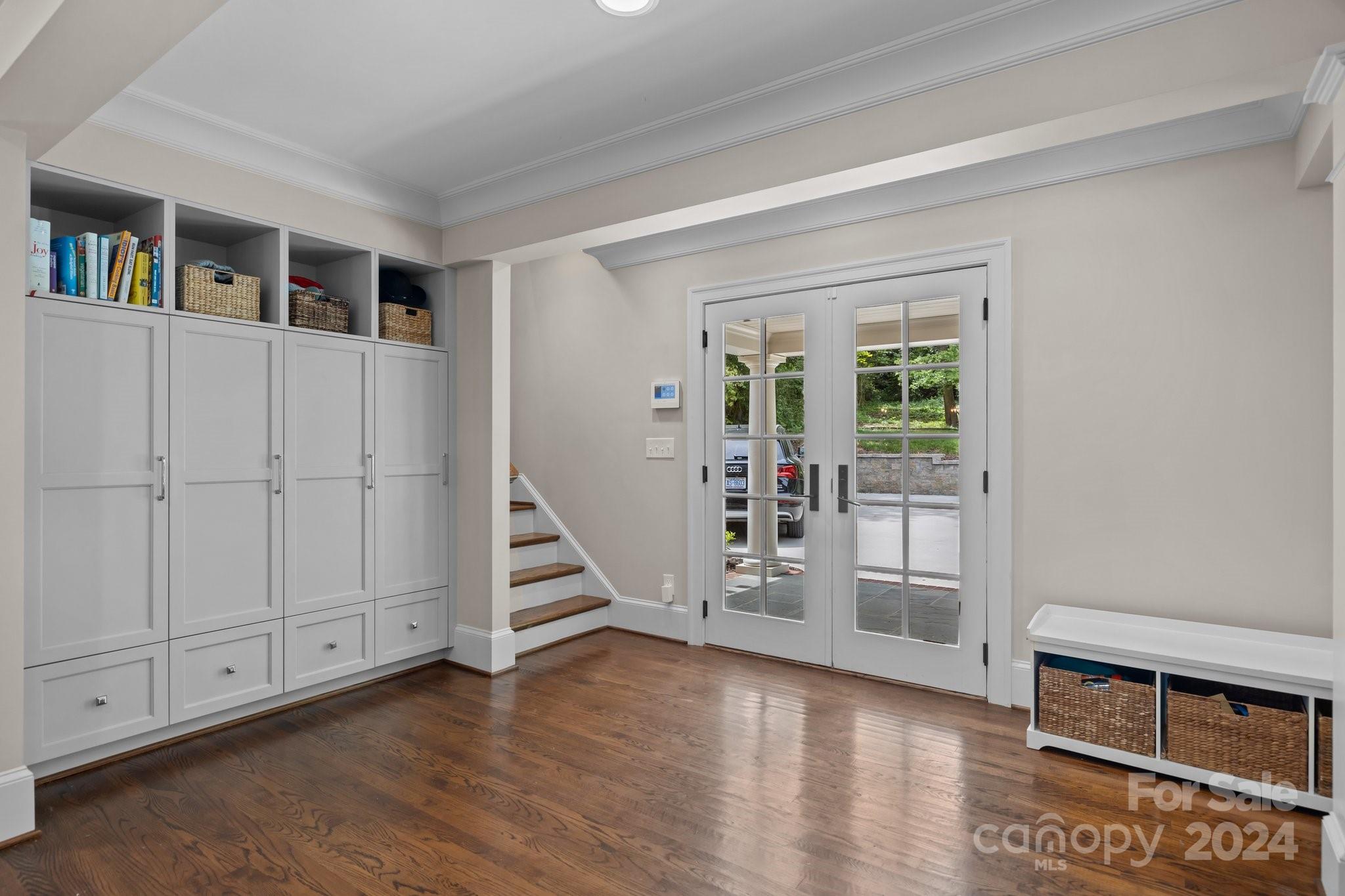 2414 Inverness Road Charlotte, NC 28209 - Photo 18 of 46 a view of an empty room with wooden floor and closet