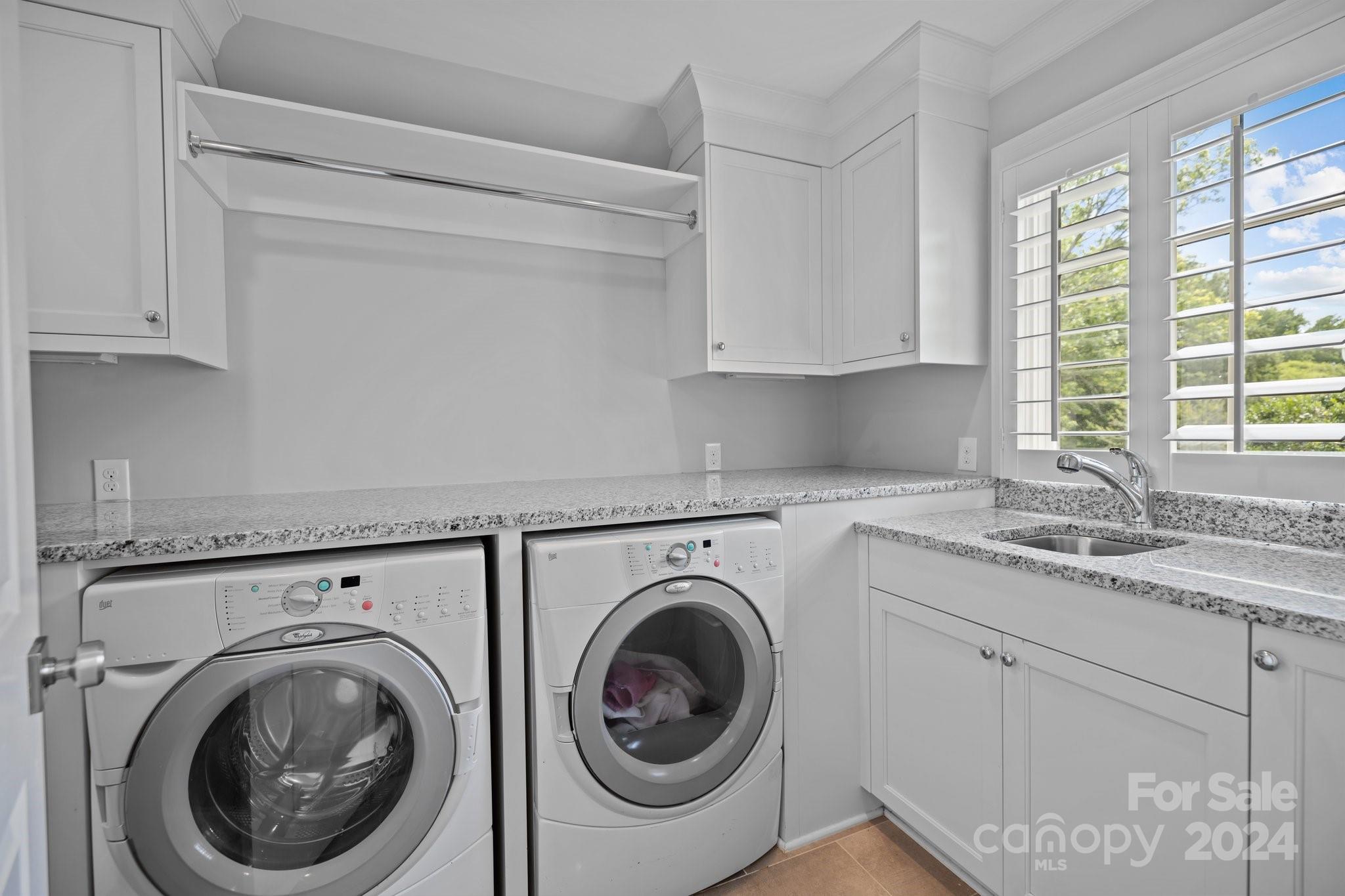 2414 Inverness Road Charlotte, NC 28209 - Photo 28 of 46 a utility room with sink dryer and washer