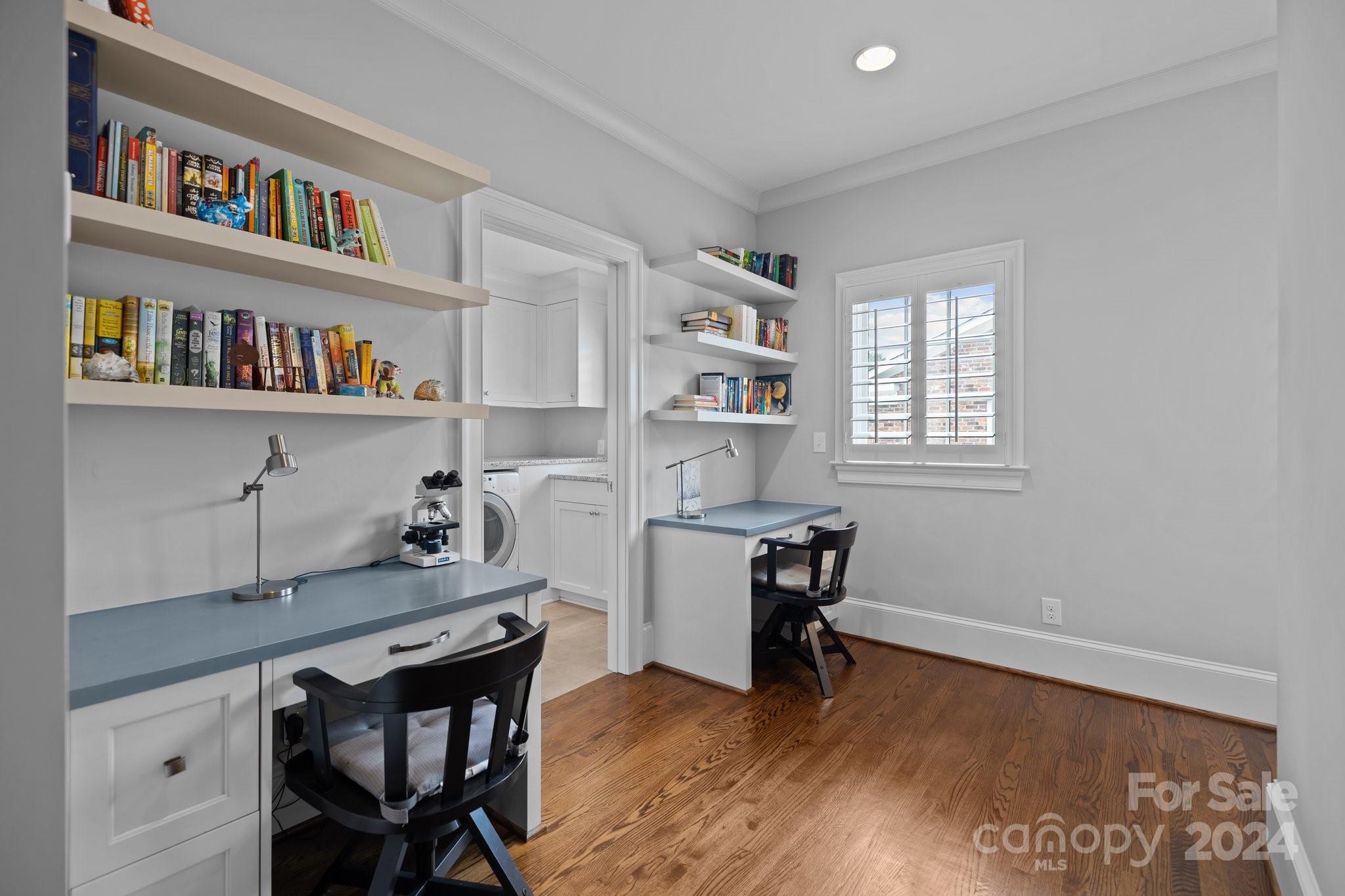 2414 Inverness Road Charlotte, NC 28209 - Photo 29 of 46 a workspace with a bookshelf