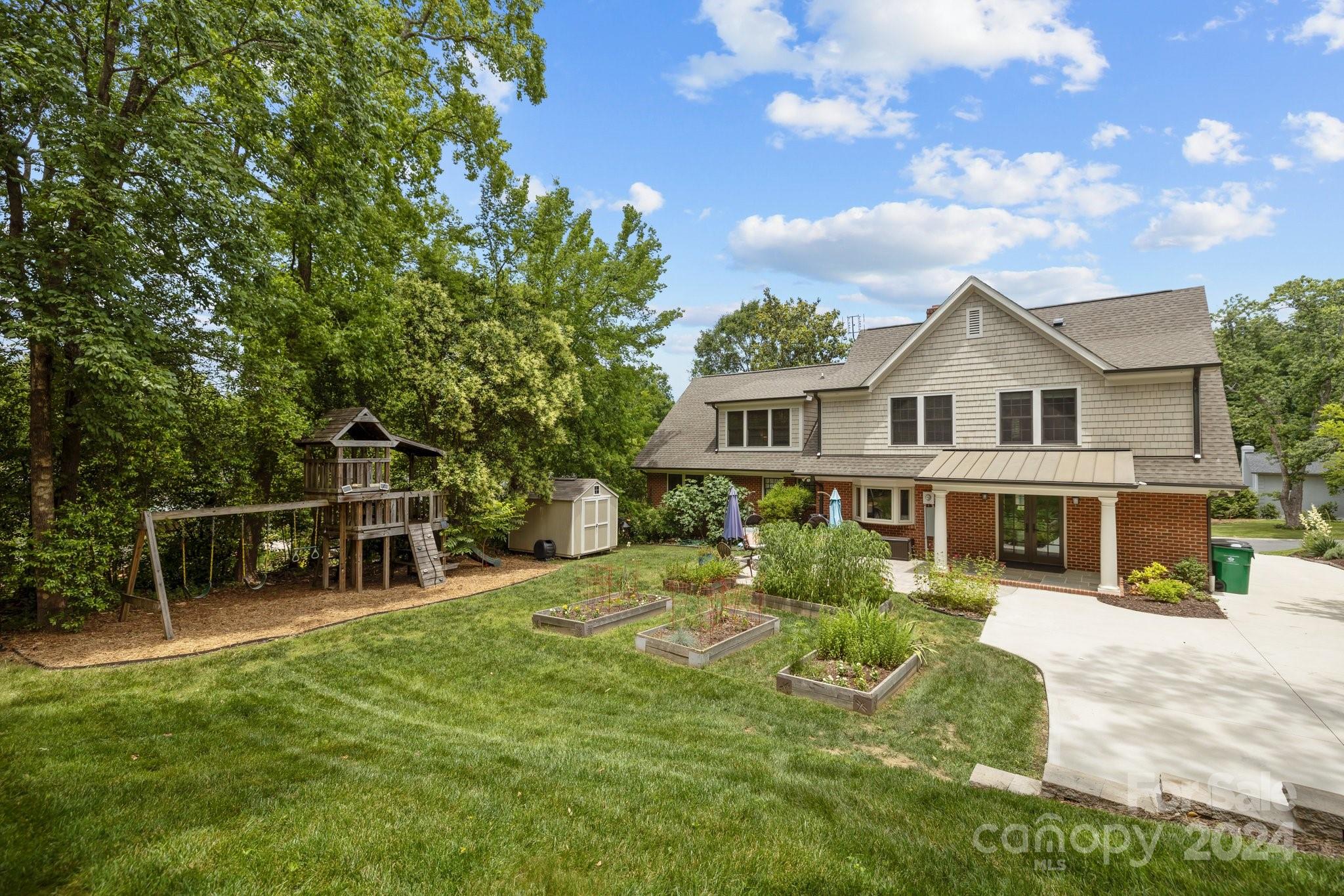 2414 Inverness Road Charlotte, NC 28209 - Photo 42 of 46 a view of a house with a yard porch and sitting area
