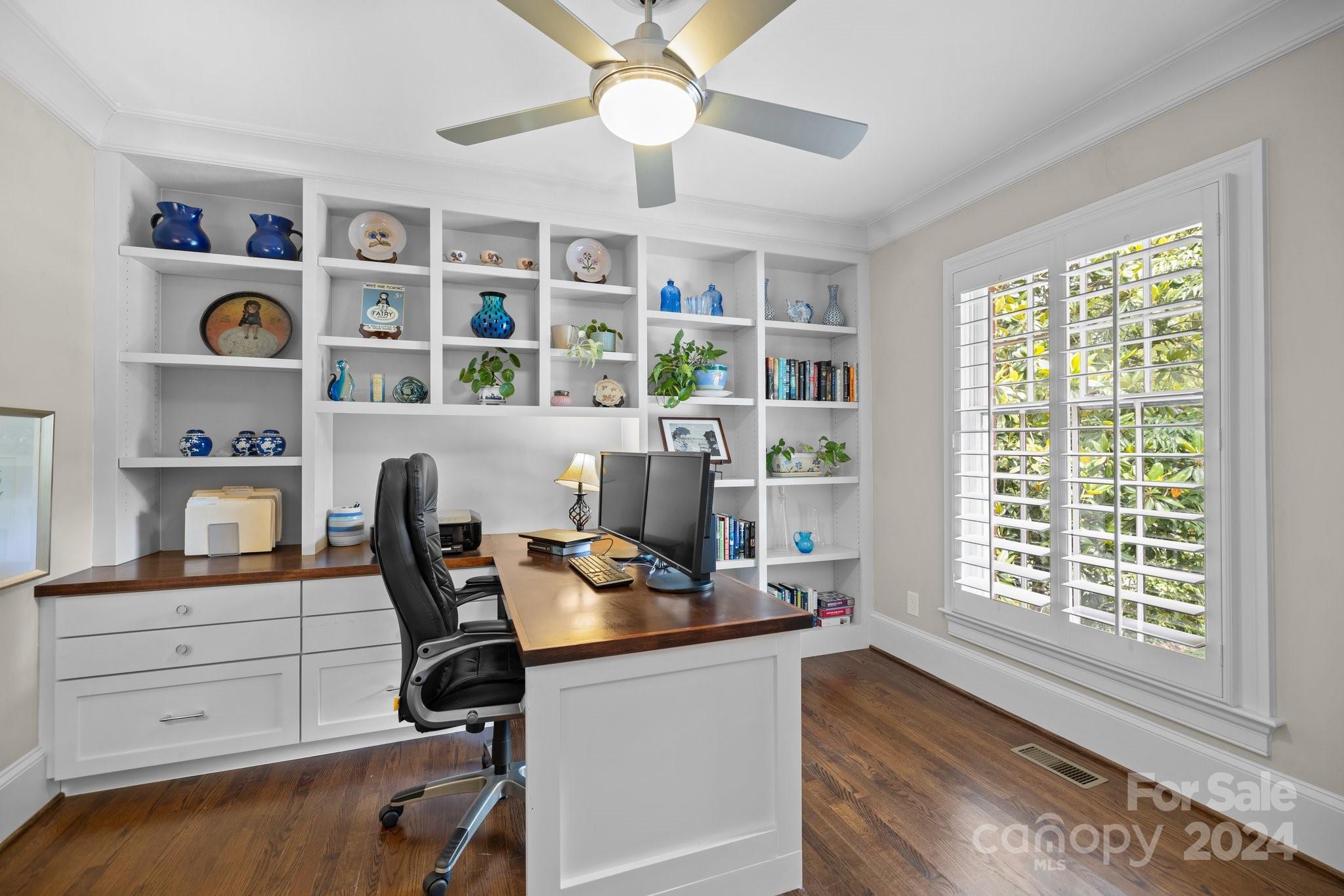 2414 Inverness Road Charlotte, NC 28209 - Photo 7 of 46 a view of a workspace with furniture and a window