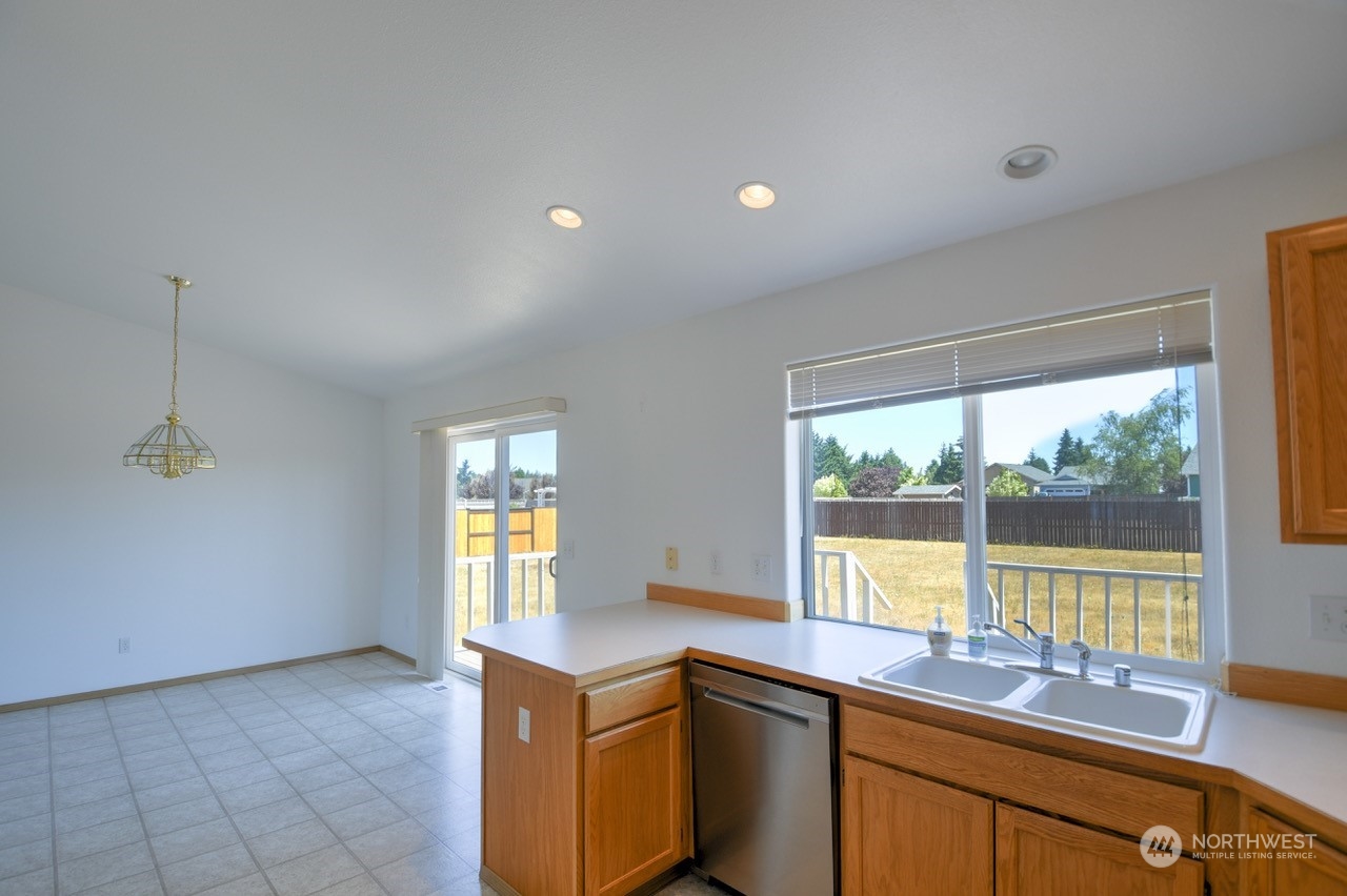 19906 Tahoma Circle Southwest Rochester, WA 98579 - Photo 8 of 20 a kitchen with a sink and large window