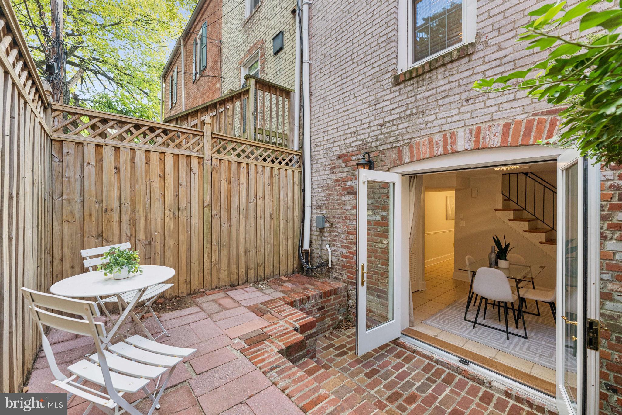 818 Independence Avenue Southeast Washington, DC 20003 - Photo 23 of 28 a view of a patio with a table and chairs and potted plants