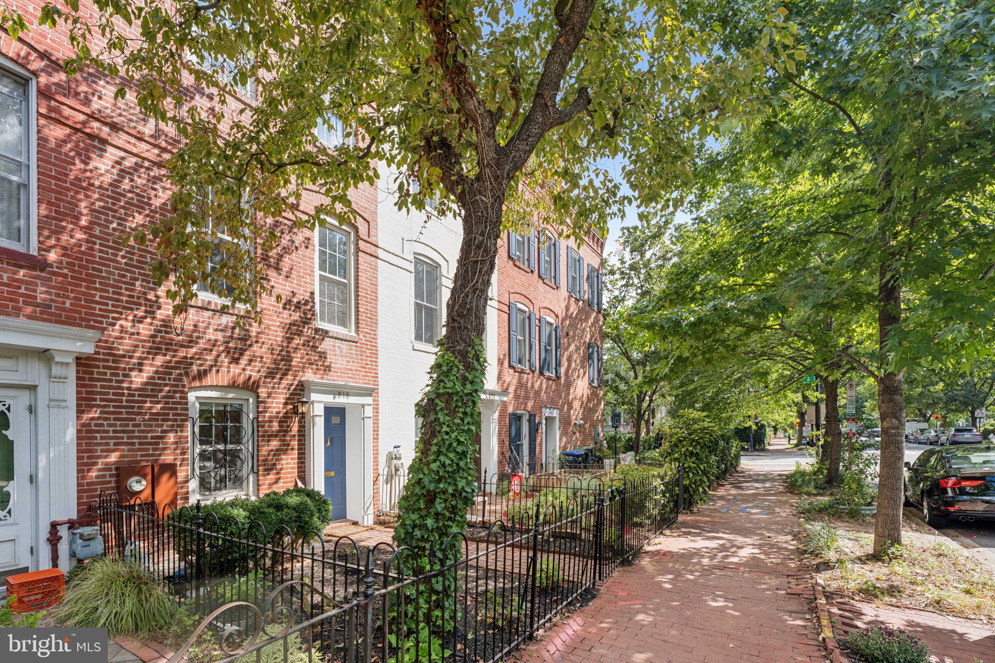818 Independence Avenue Southeast Washington, DC 20003 - Photo 3 of 28 a view of a brick building next to a road with large trees