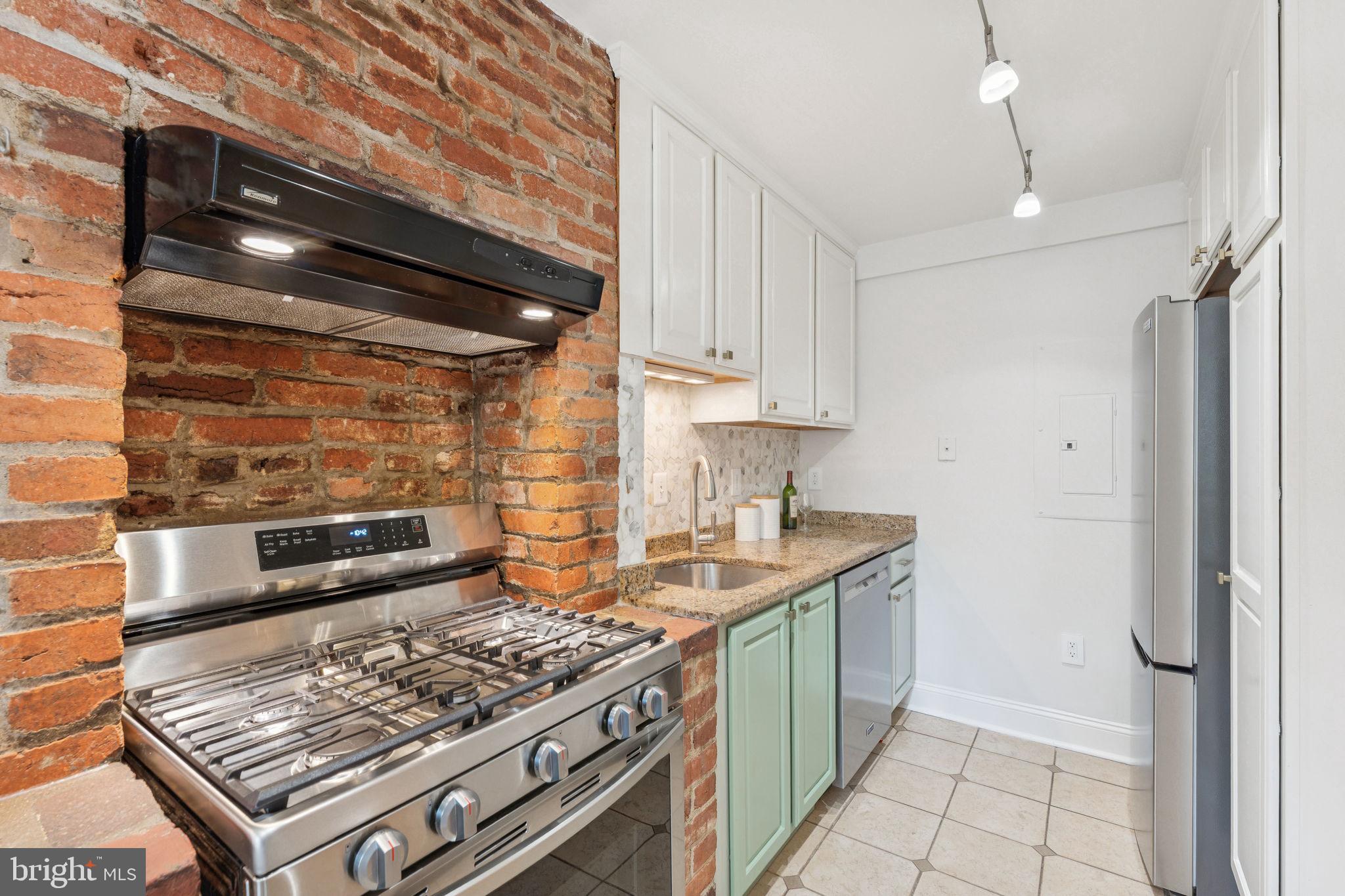 818 Independence Avenue Southeast Washington, DC 20003 - Photo 5 of 28 a kitchen with a stove and a refrigerator