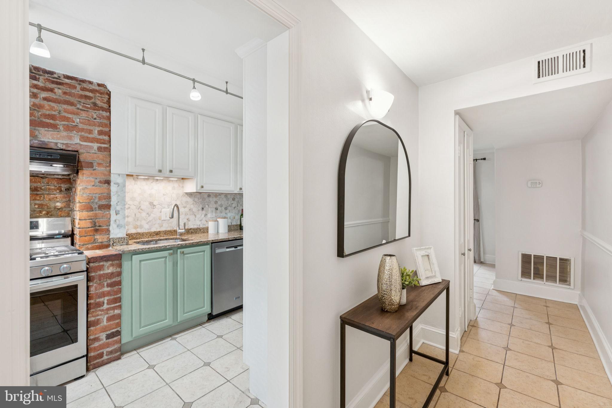818 Independence Avenue Southeast Washington, DC 20003 - Photo 7 of 28 a room with granite countertop furniture and a fireplace