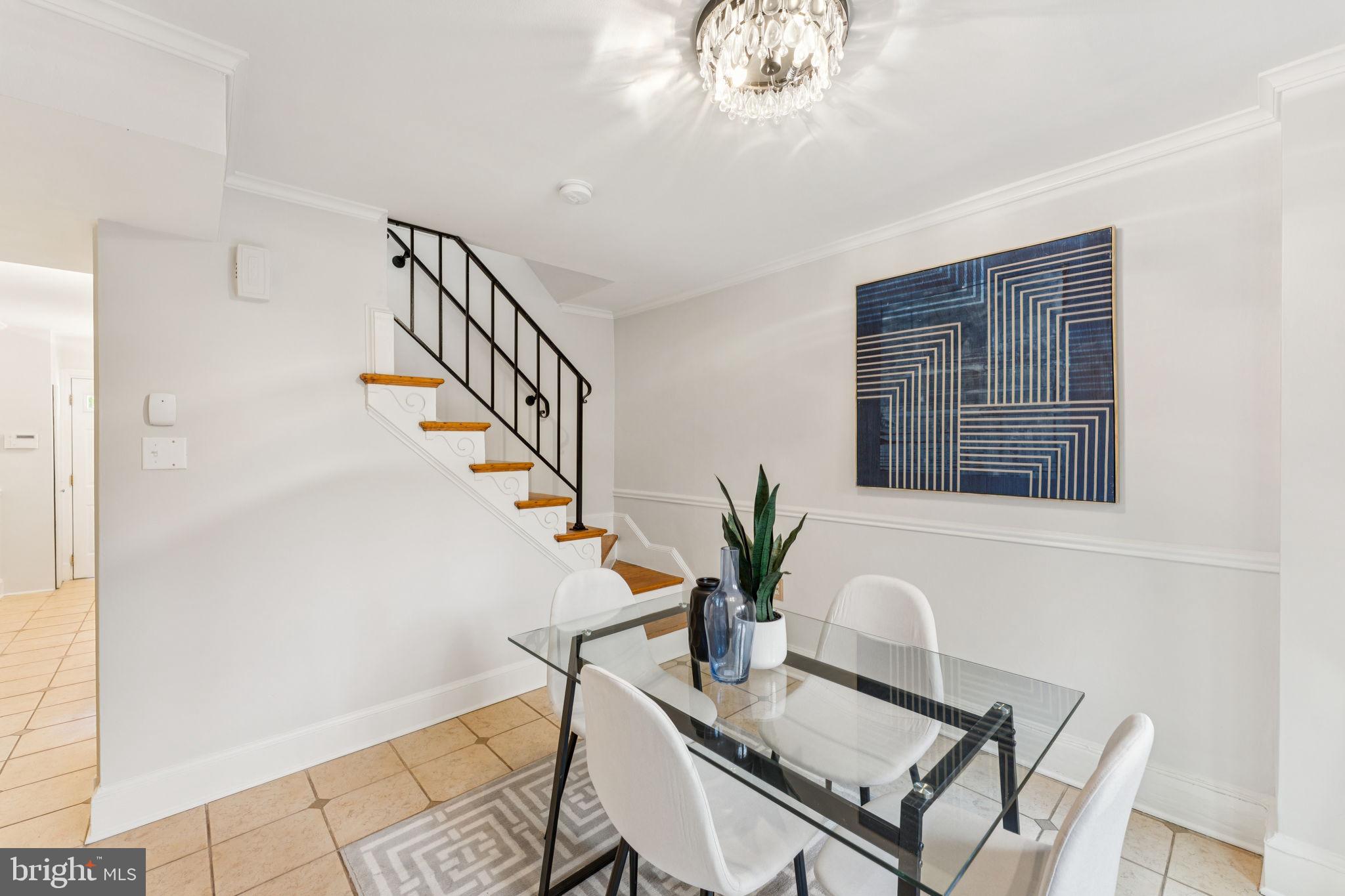 818 Independence Avenue Southeast Washington, DC 20003 - Photo 10 of 28 a dining room with furniture and chandelier