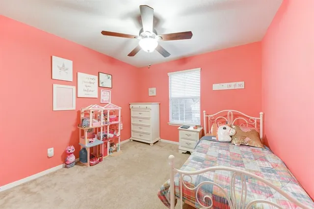 a bedroom with furniture and a chandelier