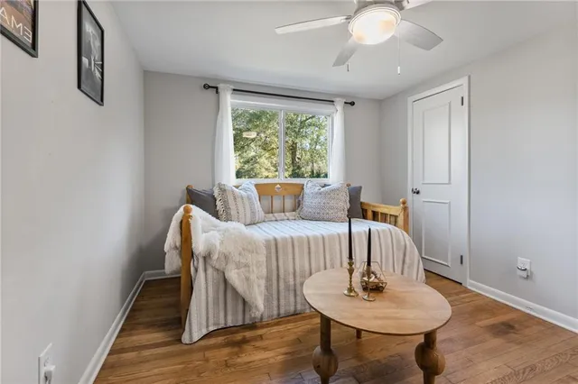 a bedroom with furniture and a window