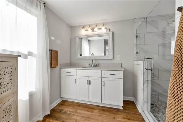 a bathroom with a sink and a mirror