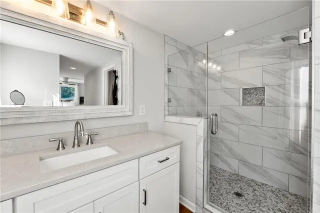 a bathroom with a sink and a mirror