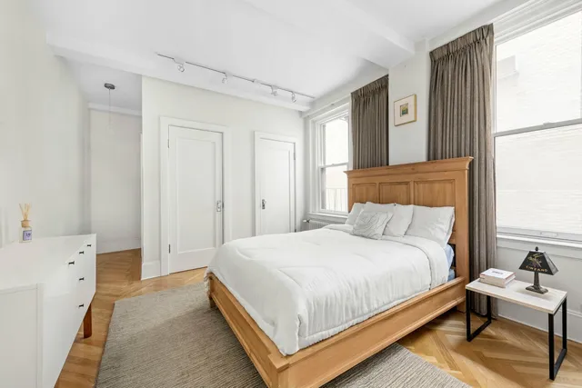 a kitchen with kitchen island a sink stainless steel appliances and cabinets