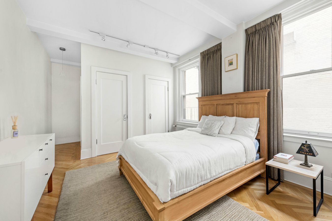 3 East 85th Street, Unit 7C Manhattan, NY 10028 - Photo 3 of 6 a bedroom with a bed and a window