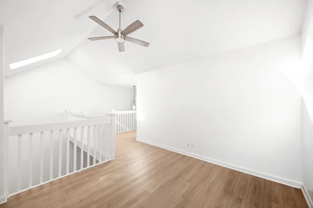 a view of a room with wooden floor