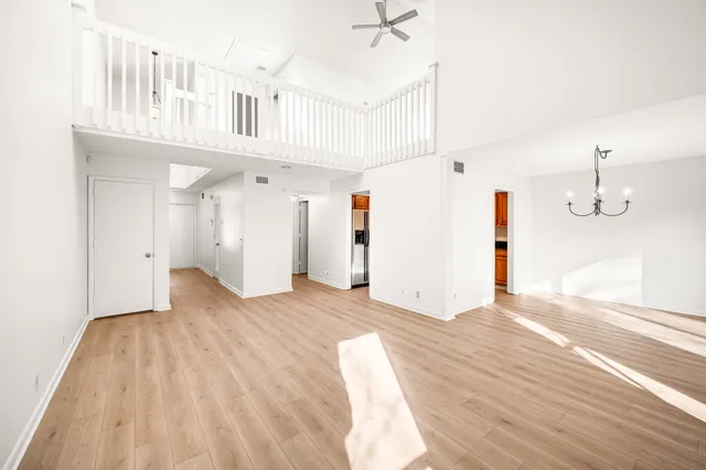 a view of a room with wooden floor