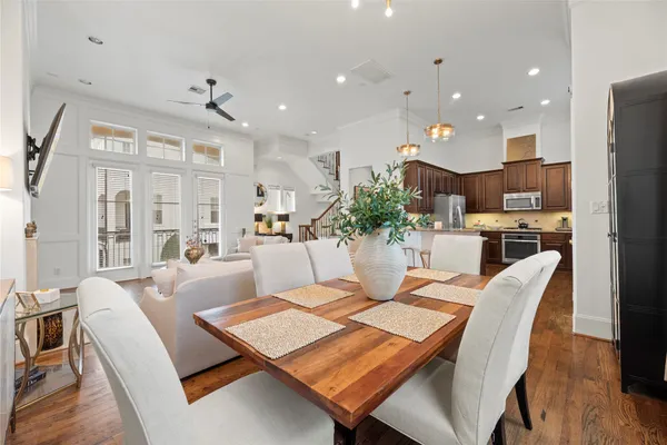 a kitchen with kitchen island granite countertop a table and chairs
