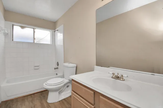 a bathroom with a sink toilet and tub