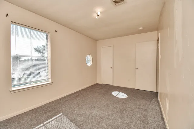 a view of empty room with window