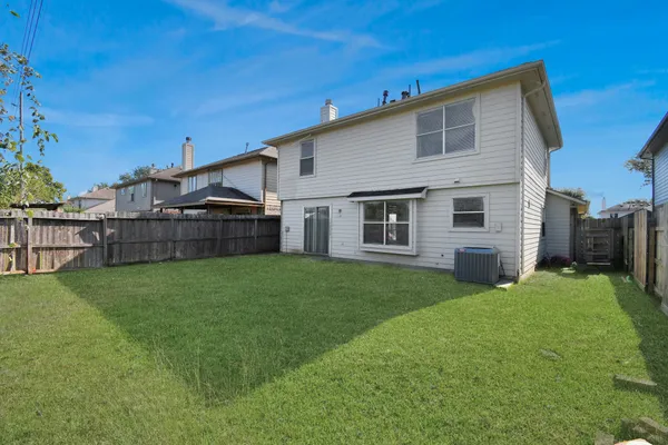 a view of a backyard with plants and a backyard